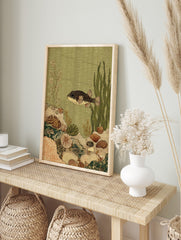 Illustrative pufferfish in an underwater scene with coral, shells, and seaweed in green and, in an alternate framed mockup