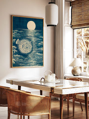 Japanese woodblock style art print of a spiky pufferfish in a dark blue moonlit ocean with waves, in a styled room mockup