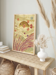 Illustrative pufferfish swimming among seaweed and wavy patterns in warm earth tones, in an alternate framed mockup