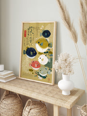 Illustrative pufferfish wall art with five colourful blowfish and Japanese text on a golden, in an alternate framed mockup