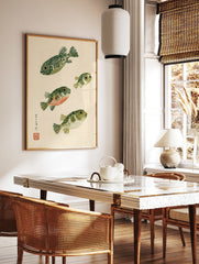 Stylised pufferfish illustration with Japanese calligraphy and red seal on cream background, in a styled room mockup