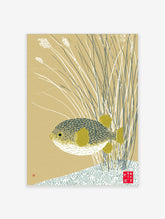 Japanese-inspired pufferfish wall art print with patterned fish and yellow fins amidst reeds on a beige background