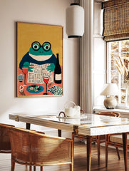 Illustrative art print of a frog in glasses reading a newspaper at a dining table with wine and food, in a styled room mockup
