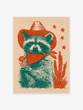 Teal raccoon in red cowboy hat and bandana holding a flower beside a cactus, with red stars on beige