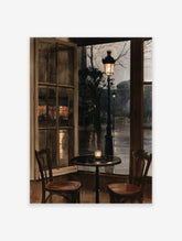Rainy cafe window wall art with a lit candle, two chairs, and a glowing streetlamp on a wet city street