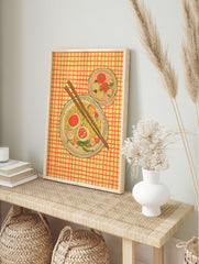 Illustrative ramen noodle bowl wall art with chopsticks, eggs, and vegetables on a yellow and orange checkered background. - Image 3