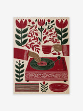 Illustration of hands playing a record player with red tulips and botanical leaves on a cream background