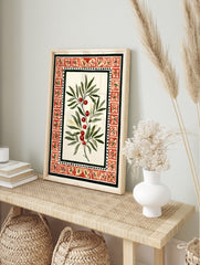 Botanical illustration of a branch with red berries and green leaves within a red tile border, in an alternate framed mockup