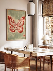 Red butterfly illustration with detailed wings and antennae on a textured greenish-blue background, in a styled room mockup