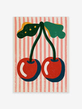 Red cherry art print with two cherries, green stems, leaves, and pink striped background