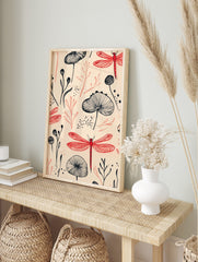 Illustrative pattern of red dragonflies and black botanical plants on a light beige background, in an alternate framed mockup