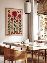 Red flower wall art with mystical eyes, green stems, crescent moons, and stars on a light background in a folk art style. - Image 2