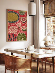 Red folk art print with plate of noodles, sliced grapefruit, pomegranate, and white flowers on, in a styled room mockup