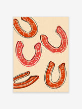Five red horseshoes with white decorative patterns and black outlines on a cream background, in an illustrative style