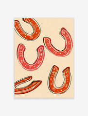 Five red horseshoes with white decorative patterns and black outlines on a cream background, in an illustrative style