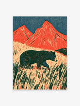 Red mountain bear poster with dark bear walking through tall grass and two orange peaks under a blue sky