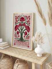Red mushroom botanical illustration with green stems and roots, folk art style on light, in an alternate framed mockup