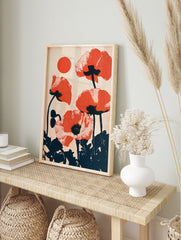 Red poppy flower wall art with a retro halftone dot effect and a circular sun motif on a, in an alternate framed mockup