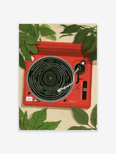 Vibrant illustration of a red record player surrounded by tropical green leaves on a beige background