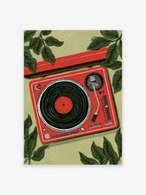 Illustrative red turntable with vinyl record and green leaves in a flat-lay composition on a light green background
