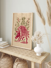 Red wild boar illustration with spiky mane and stripes, standing amidst green bamboo stalks, in an alternate framed mockup