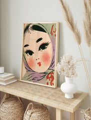 Retro illustration of a girl wearing a teal headscarf with blushed cheeks and red lips, in an alternate framed mockup