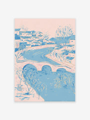 Illustrative riverside village wall art with pink and blue houses, a bridge over a river, and bare trees.