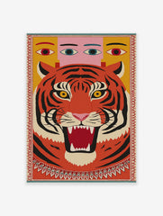 Roaring tiger head with black stripes and yellow eyes, human-like eyes above, framed by a decorative border