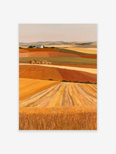 Rolling harvest fields landscape wall art with golden wheat, hay bales, and a white farmhouse on a hill