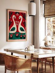 Romantic folk art painting of two cream swans with wine glasses, red background, green foliage, in a styled room mockup