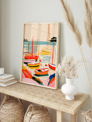 Abstract sailboat harbour wall art with vibrant red, orange, and yellow boats on blue water, in an alternate framed mockup