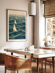 Four sailing boats with white sails and orange hulls on a deep blue sea in an illustrative nautical, in a styled room mockup