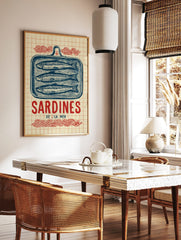 Vintage illustrative print of three blue sardines in a tin, with 'Sardines De L'La Mer' text and, in a styled room mockup