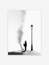 Black and white saxophone wall art featuring a silhouetted jazz musician playing under a lamppost on a cobblestone street.