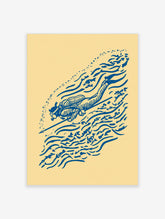 Blue illustrative scuba diver print with speargun, fish, and bubble motifs on a cream background