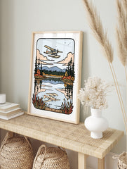 Seaplane flying over a calm lake with mountain and forest background in an illustrative, in an alternate framed mockup
