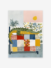 Illustrated sleeping alligator on a multi-colored patchwork quilt with plants and a yellow sun in a whimsical wall art print.