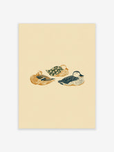 Illustrative print of three sleeping ducks in golden-brown, dark blue, and floral green on a light beige background