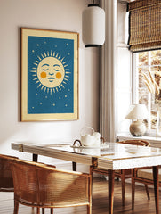 Retro sleeping sun illustration with orange cheeks and stars on a deep blue background, unframed, in a styled room mockup