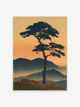 Japanese-style landscape print of a solitary pine tree on a ridge against misty mountains and an orange sunset sky