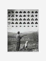 Monochrome print of a man with a shotgun and dog looking at pixelated Space Invaders in a rural landscape