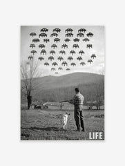 Monochrome print of a man and dog in a field looking up at pixelated Space Invaders in the sky, with 'LIFE' logo