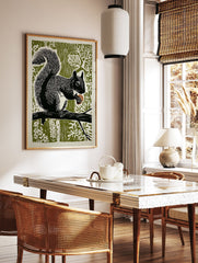 Black and white linocut art print of a squirrel holding an acorn on a branch against an olive green forest background. - Image 3
