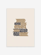 Stacked books wall art print with five patterned spines in tan, black and white on a plain background