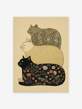 Stacked cat wall art featuring three illustrative cats, two with floral botanical patterns and one solid beige, on a light background.
