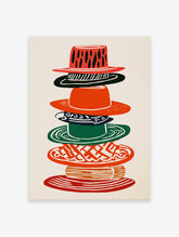 Multi-color stacked hats wall art illustration with various patterns in red, green, black, and orange on a cream background.