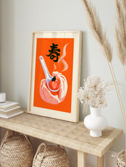Steamed bun with peach on a spoon illustration, featuring the kanji for longevity, on a bold, in an alternate framed mockup