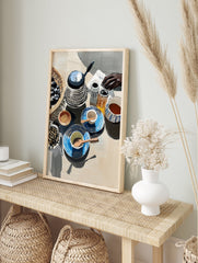 Still life poster of a breakfast table with a kettle, patterned blue cups, a basket of olives, and a hand reaching. - Image 4