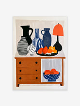 Modern illustrative wall art of a console table with vases, lamp, and fruit bowls on a neutral background