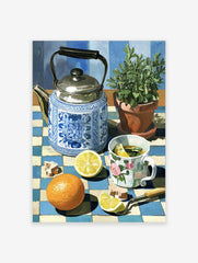 Still life painting of a blue and white teapot, lemon tea, orange, and plant on a checkered tablecloth, vibrant kitchen wall art.